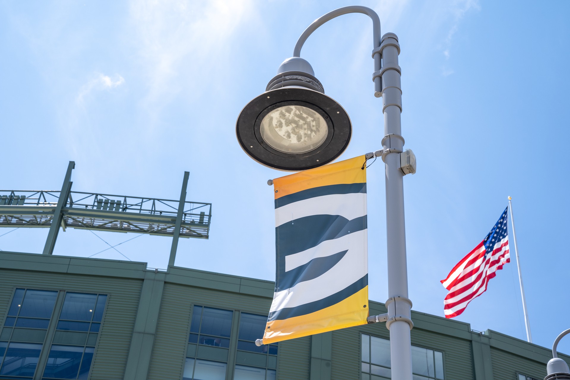 Green Bay Packers NFL team logo flag on a lamp post at Lambeau Field